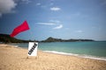 Concept quarantine, pandemic, coronavirus, travel ban. tropical beach on a sunny day without people. there is a red flag Royalty Free Stock Photo