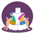 The concept of quarantine, self-isolation and panic. A guy and a girl are sitting on a pile of toilet paper and looking at a cell Royalty Free Stock Photo