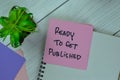 Concept of Ready to Get Published write on sticky notes isolated on Wooden Table