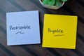 Concept of Receivable Payable write on sticky notes isolated on Wooden Table