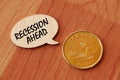 Concept of Recession Ahead write on wooden sign isolated on Wooden Table. Royalty Free Stock Photo