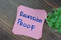 Concept of Recession Proof write on sticky notes isolated on Wooden Table Royalty Free Stock Photo