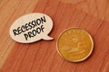 Concept of Recession Proof write on wooden sign isolated on Wooden Table. Royalty Free Stock Photo