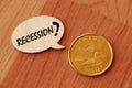 Concept of Recession write on wooden sign isolated on Wooden Table. Royalty Free Stock Photo