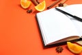 Concept of recipe book on orange background, space for text Royalty Free Stock Photo