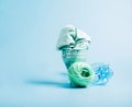 The concept recycling plastic. Empty plastic bottle and recycled polyester fiber, synthetic fabric blue background Royalty Free Stock Photo