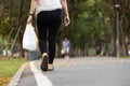 Concept of recycling,reduce the amount of waste,asian woman carrying a plastic bag used in a previous shopping session for reuse, Royalty Free Stock Photo