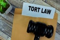 Concept of Red Handle Rubber Stamper and Tort Law text isolated on on Wooden Table