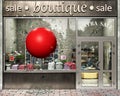 Concept of red sphere symbolizing super sale destroying boutique showcase, sales break outside.