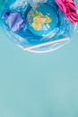 The concept of reducing plastic bags use: Modeled globes are sunk in many white plastic bags. Meaning, plastic bags are about to Royalty Free Stock Photo