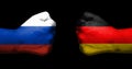 Concept of relations/conflict between Germany and Russia symbolized by two opposed clenched fists