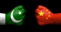 Concept of relations between Pakistan and China symbolised by two opossed clenched fists Royalty Free Stock Photo