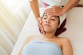 Concept relaxation and health spa. Beautiful woman getting spa face massage. facial beauty treatment in spa salon Royalty Free Stock Photo