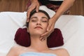 Concept relaxation and healthy spa. Beautiful woman getting spa face massage. facial beauty treatment in spa salon Royalty Free Stock Photo