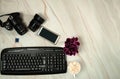 Camera, lens, memory card, keyboard, smartphone and a mug of delicious cocoa with marshmallows on a pastel green marble background Royalty Free Stock Photo