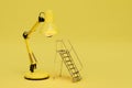 the concept of replacing a light bulb. a staircase and a lamp on a yellow background. copy paste. 3D render Royalty Free Stock Photo