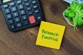 Concept of Research Funding write on sticky notes isolated on Wooden Table