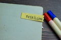 Concept of Reskilling write on sticky notes isolated on Wooden Table Royalty Free Stock Photo
