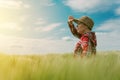 Concept of responsible farming, female farmer in cereal crops field Royalty Free Stock Photo