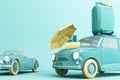 Concept retro car with luggage surrounded by travel equipment in green