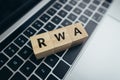 Concept Risk weighted asset or RWA. business acronym. Cubes with letters on a laptop. Royalty Free Stock Photo