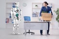 Concept of robots replacing humans in offices Royalty Free Stock Photo