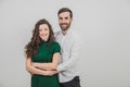 Portrait of beautiful smiling couple posing at studio over white background. Royalty Free Stock Photo