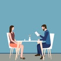 Concept of a romantic or business dinner in a restaurant. Man and woman sit at a table and a guy reads a menu. People have lunch