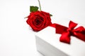 Concept of romantic gift with red rose and boxes with jewelry Royalty Free Stock Photo