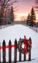 A Rustic Wooden Fence Adorned With A Snowy Wreath, Twinkling Lights, And Red Ribbons, Captured During A Sunset. Generative AI