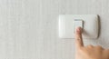 Concept save energy. Hand turning off switch Royalty Free Stock Photo