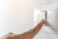 Concept save energy. Hand turning off switch Royalty Free Stock Photo