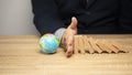 Concept of saving the world cleaning, campaign Natural environment, global warming, men`s hands blocking wooden blocks prevent