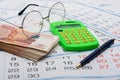 Concept of savings savings for old age, money, pen, calculator and glasses Royalty Free Stock Photo