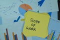 Concept of Scope of Work write on sticky notes isolated on Wooden Table