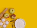 The concept of seasonal Apple baking. Ingredients for Apple pie on the yellow table.