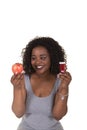 Concept shoot about health care of a woman choosing between an apple and a pill bottle Royalty Free Stock Photo