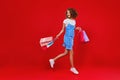 Concept of shopping purchases and sales of happy young girl with packages  on yellow background Royalty Free Stock Photo