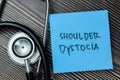 Concept of Shoulder Dystocia write on sticky notes  on Wooden Table Royalty Free Stock Photo