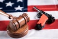 Concept showing of US or American gun laws with Judge gavel and Vintage Pistol on American flag Royalty Free Stock Photo