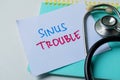 Concept of Sinus Trouble write on sticky notes with stethoscope isolated on white background Royalty Free Stock Photo