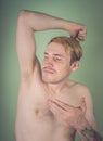 Guy sniffs his armpits Royalty Free Stock Photo