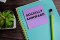 Concept of socially awkward write on sticky notes isolated on Wooden Table Royalty Free Stock Photo