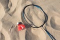 The concept of sports and active lifestyle. Racket and shuttlecock on the sand. View from above