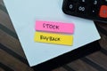 Concept of Stock Buyback write on sticky notes with calculator isolated on Wooden Table Royalty Free Stock Photo