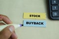 Concept of Stock Buyback write on sticky notes isolated on Wooden Table Royalty Free Stock Photo
