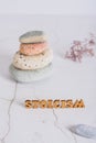 Concept of stoicism wooden letters on the background of a pyramid of stones vertical view