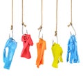 Concept of subjection. Clothes hanging on fishing hooks isolated