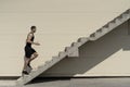 Concept of success and achieving your goal, man climbing stairs. Royalty Free Stock Photo