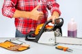 Concept success in small business. Repair of chainsaws,gasoline powered tools